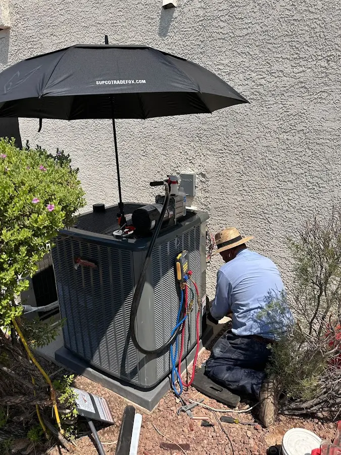 HVAC technician performing outdoor AC maintenance in Sea Cliff
